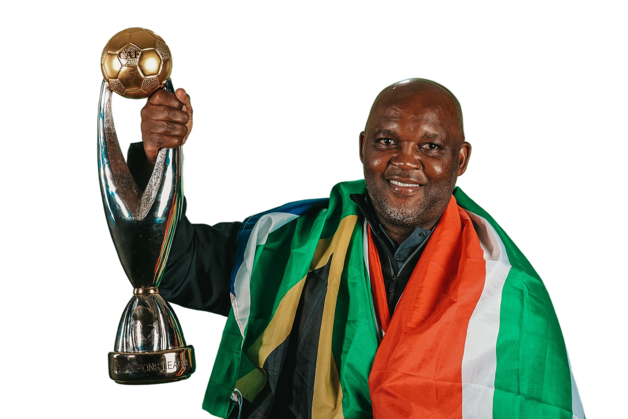 Dr. Pitso Mosimane holding a championship trophy